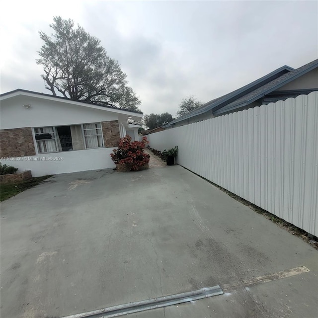 view of property exterior with fence