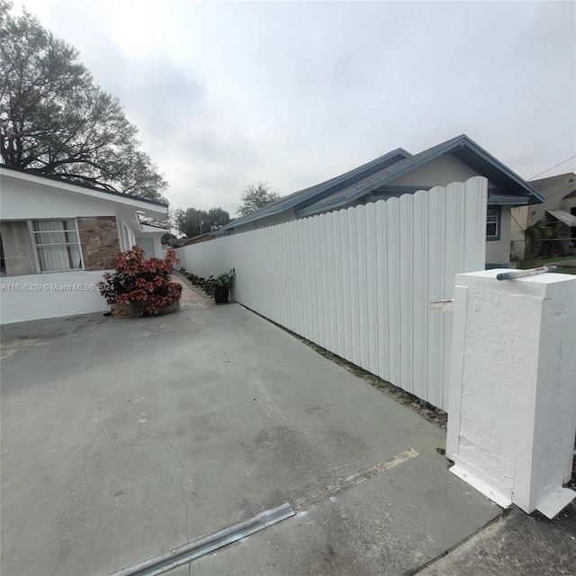 view of property exterior with fence