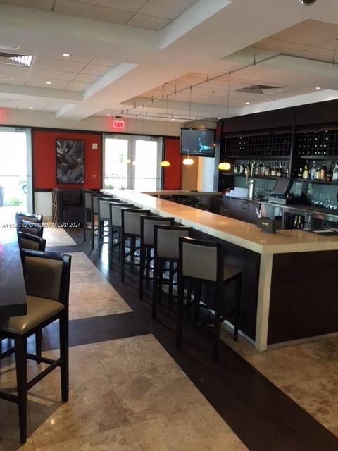 bar featuring tile patterned floors