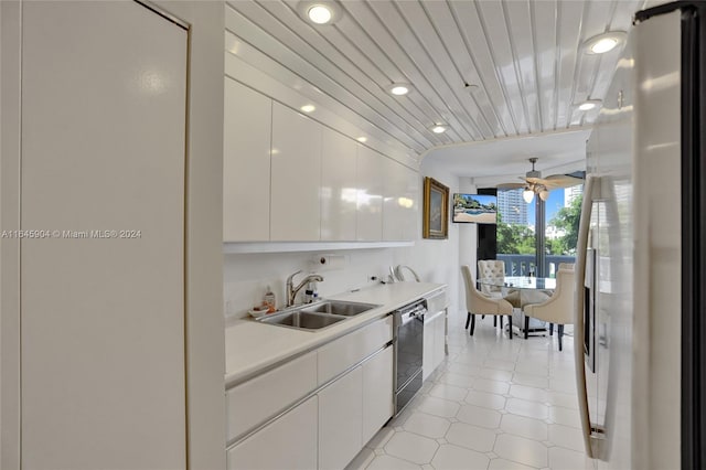 kitchen with white cabinetry, sink, stainless steel refrigerator, and dishwasher