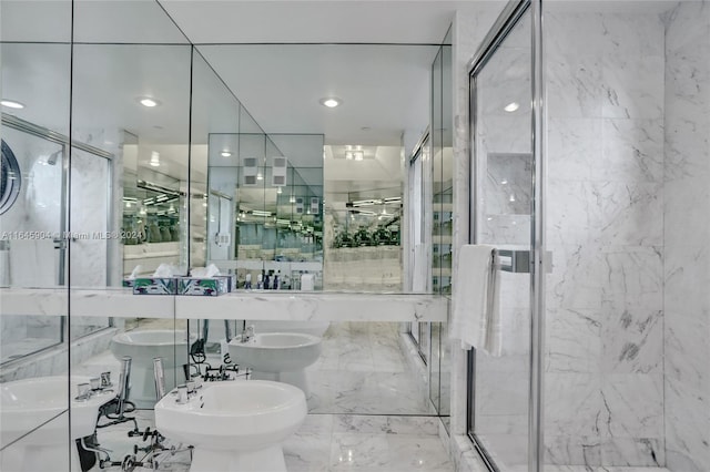 bathroom featuring toilet, tile patterned floors, tile walls, a bidet, and a shower with shower door