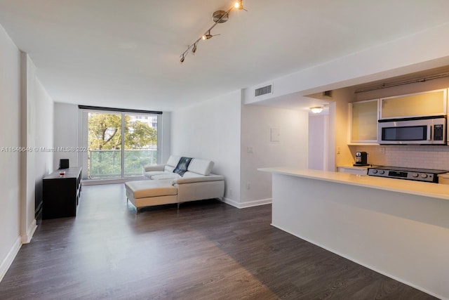 unfurnished living room with dark wood-type flooring