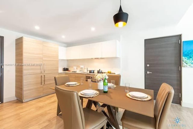 dining area with light wood-type flooring