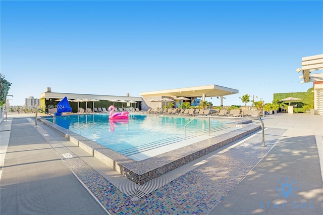 view of swimming pool featuring a patio area