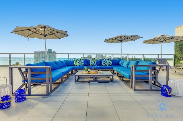 view of patio / terrace with a water view and an outdoor hangout area