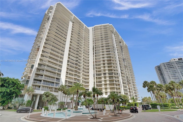 view of building exterior featuring a community pool