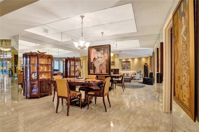 dining room with a notable chandelier