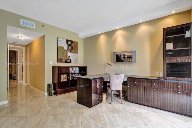 home office featuring wine cooler and a large fireplace