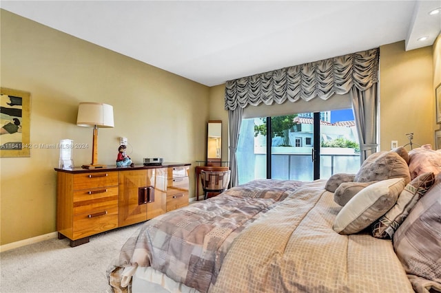 bedroom featuring carpet flooring and access to exterior