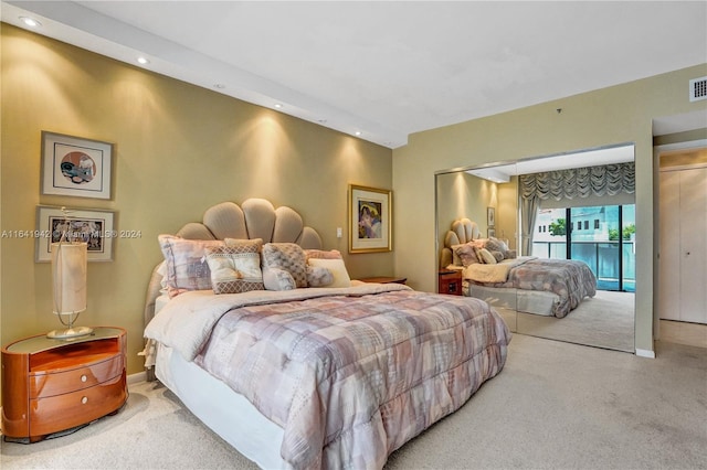 carpeted bedroom with access to exterior