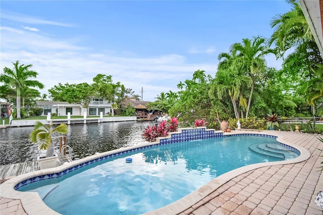 view of pool with a water view