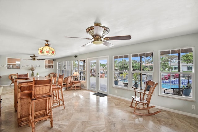 interior space featuring ceiling fan and french doors