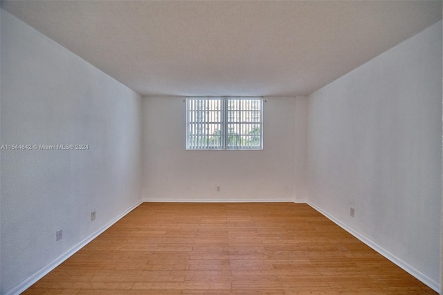 unfurnished room featuring light hardwood / wood-style floors