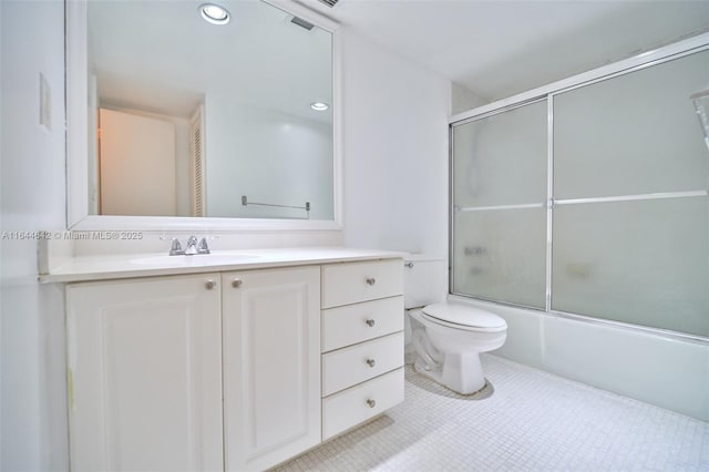 bathroom with bath / shower combo with glass door, toilet, tile patterned floors, vanity, and recessed lighting