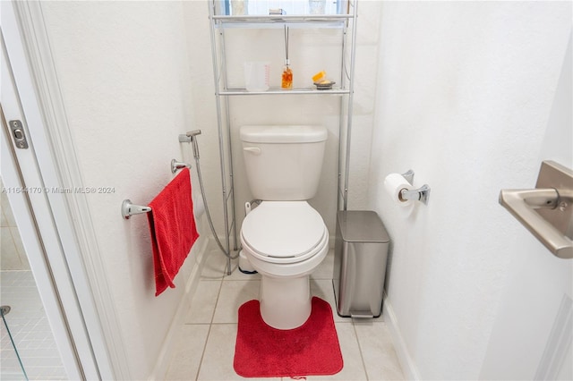 bathroom featuring tile patterned flooring and toilet