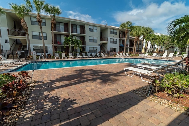 pool with a patio area