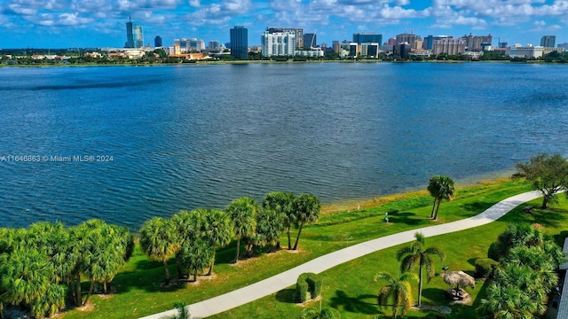 bird's eye view featuring a view of city and a water view