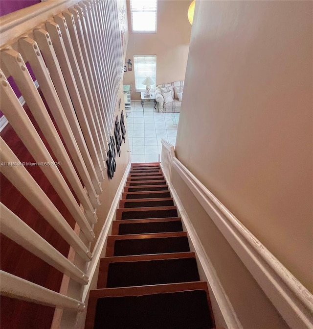 staircase with tile patterned flooring