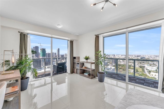 tiled living room with a chandelier, a view of city, and a healthy amount of sunlight