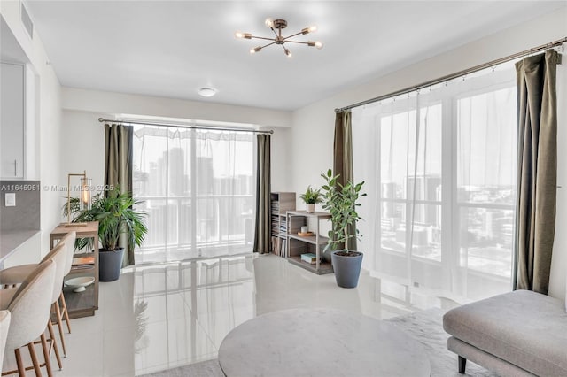interior space with visible vents and an inviting chandelier