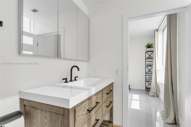 bathroom featuring vanity and visible vents