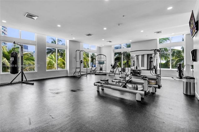 exercise room featuring recessed lighting, visible vents, and baseboards