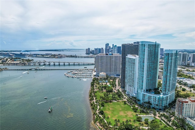 birds eye view of property featuring a water view and a view of city