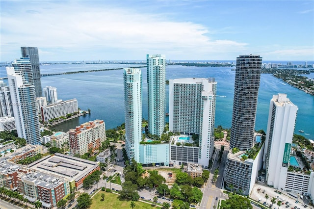 birds eye view of property featuring a water view and a view of city