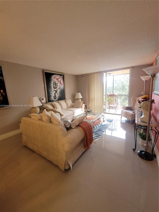 living room featuring a wall of windows