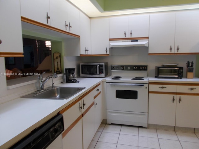 kitchen with white cabinets, sink, white appliances, and light tile patterned floors