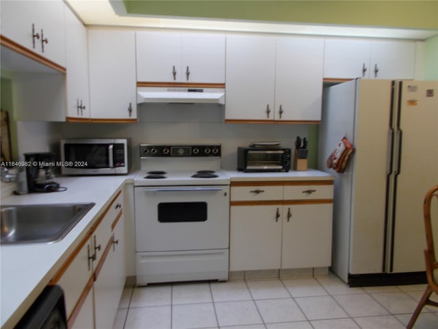 kitchen featuring sink, white appliances, ventilation hood, light tile patterned floors, and white cabinets