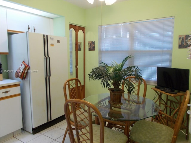 dining area featuring light tile patterned floors