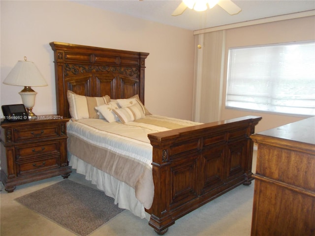 bedroom featuring ceiling fan and light colored carpet