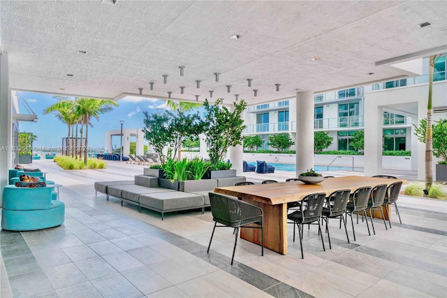 view of patio featuring an outdoor bar