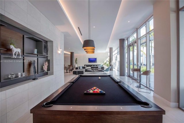 rec room with tile walls and pool table