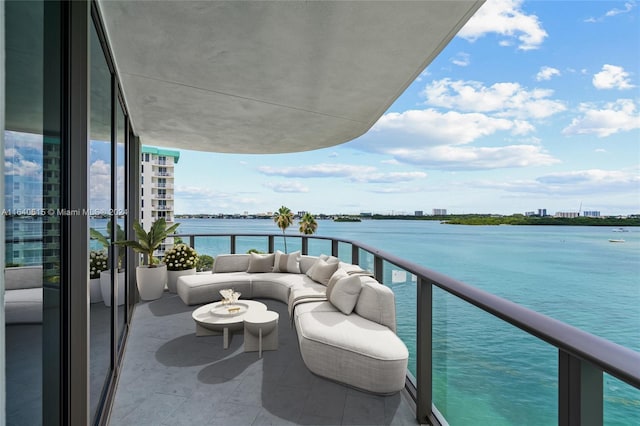 balcony featuring a water view