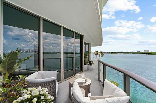 balcony featuring a water view