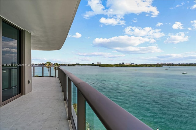 balcony featuring a water view