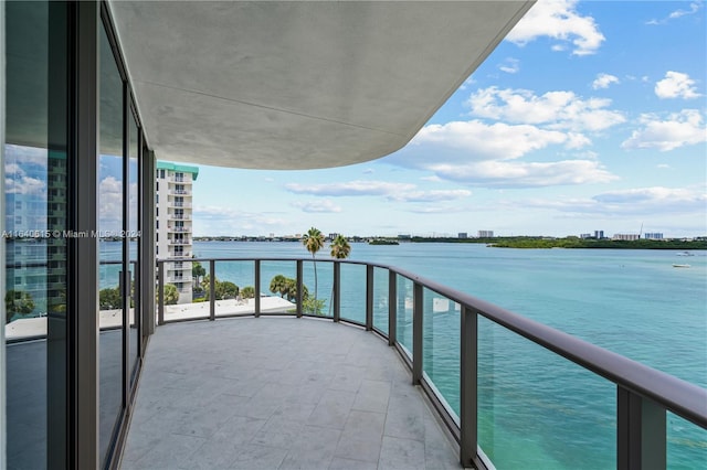 balcony featuring a water view