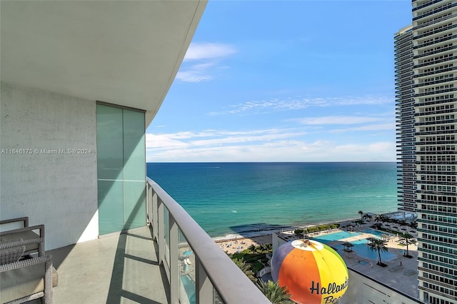 balcony featuring a water view