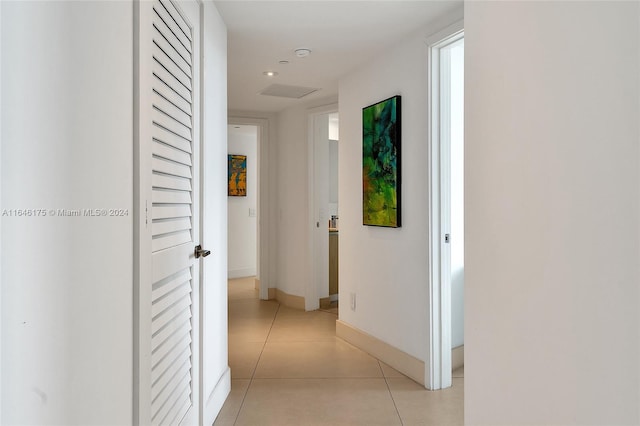 hallway with light tile patterned flooring