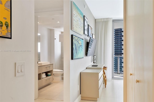 hall featuring light tile patterned floors