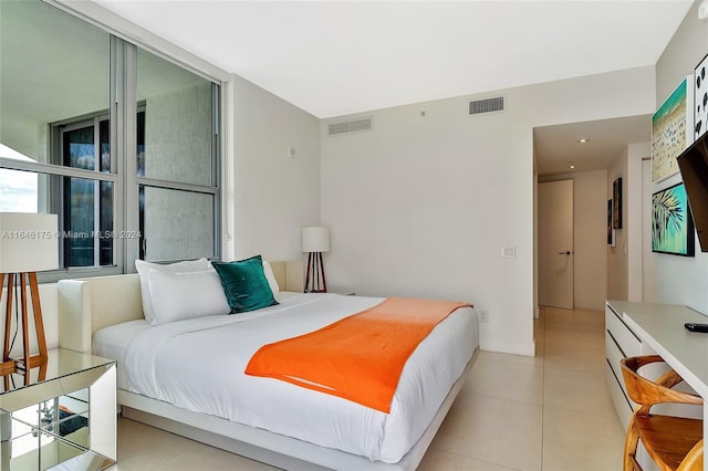 bedroom featuring light tile patterned floors