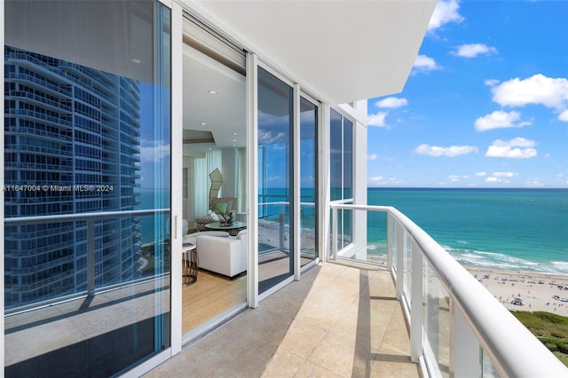 balcony with a view of the beach and a water view