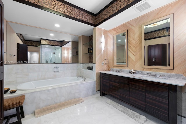 bathroom featuring double vanity, visible vents, a garden tub, a shower stall, and a sink