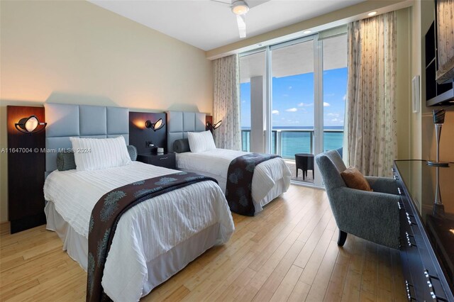 bedroom with ceiling fan and light hardwood / wood-style floors