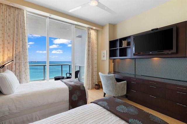 bedroom featuring ceiling fan and light hardwood / wood-style flooring