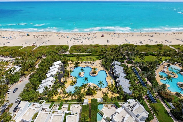 bird's eye view featuring a water view and a view of the beach