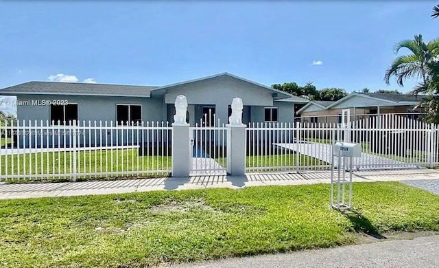 ranch-style house with a fenced front yard, a front yard, and stucco siding