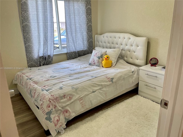 bedroom with wood finished floors